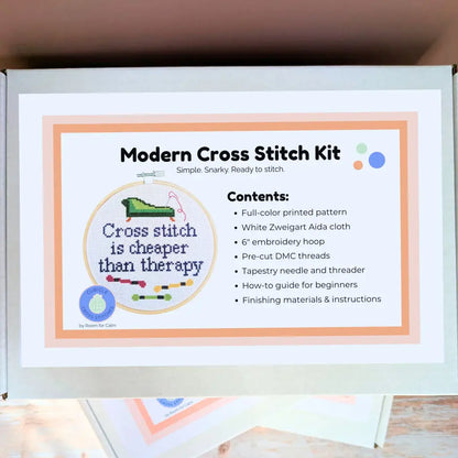 Modern Cross Stitch Kit packaging with text and graphics on a white background