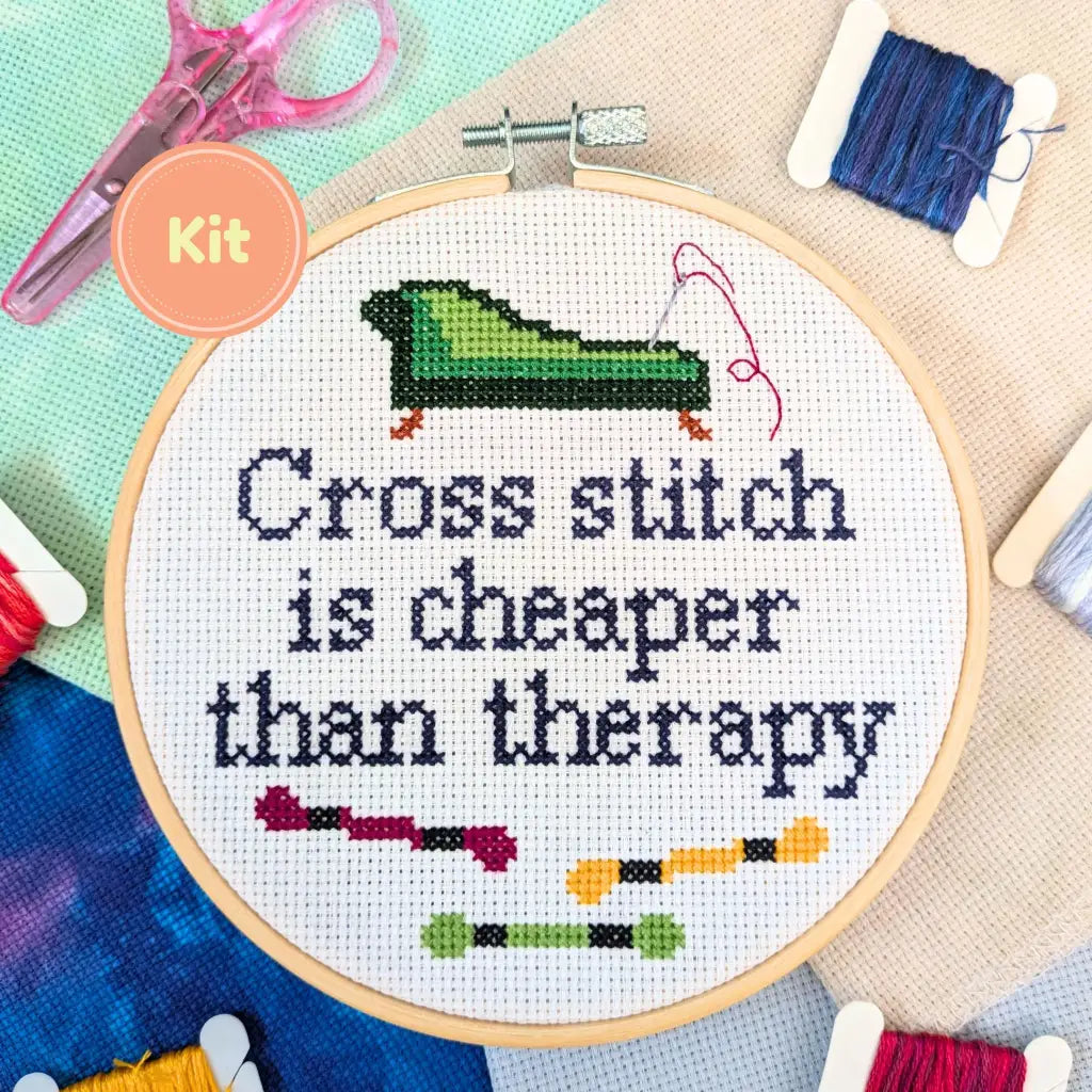 Room for Calm "Cheaper Than Therapy" cross stitch kit with hoop, threads, and scissors on a colorful background