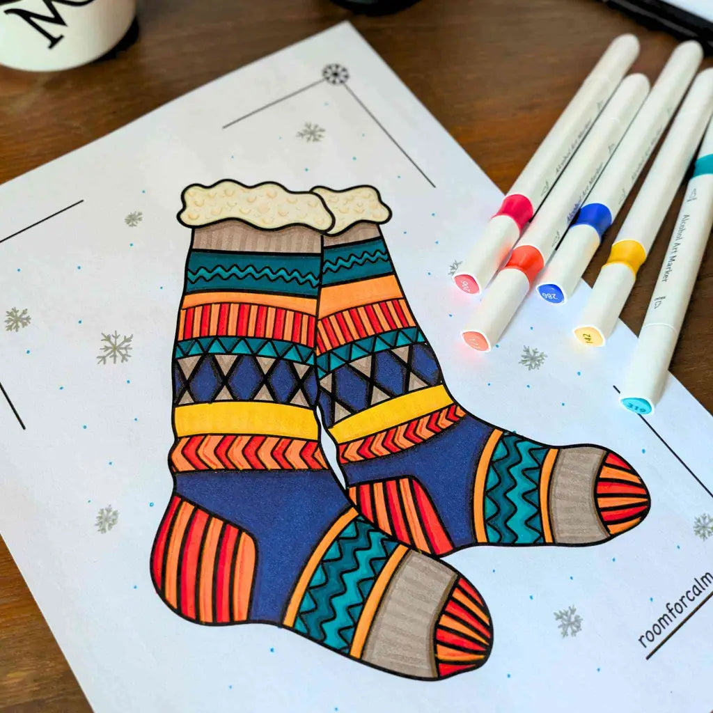 Colorful sock illustration on a coloring book page with markers.