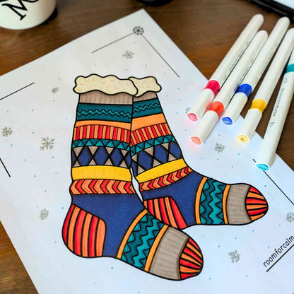 Colorful sock illustration on a coloring book page with markers.